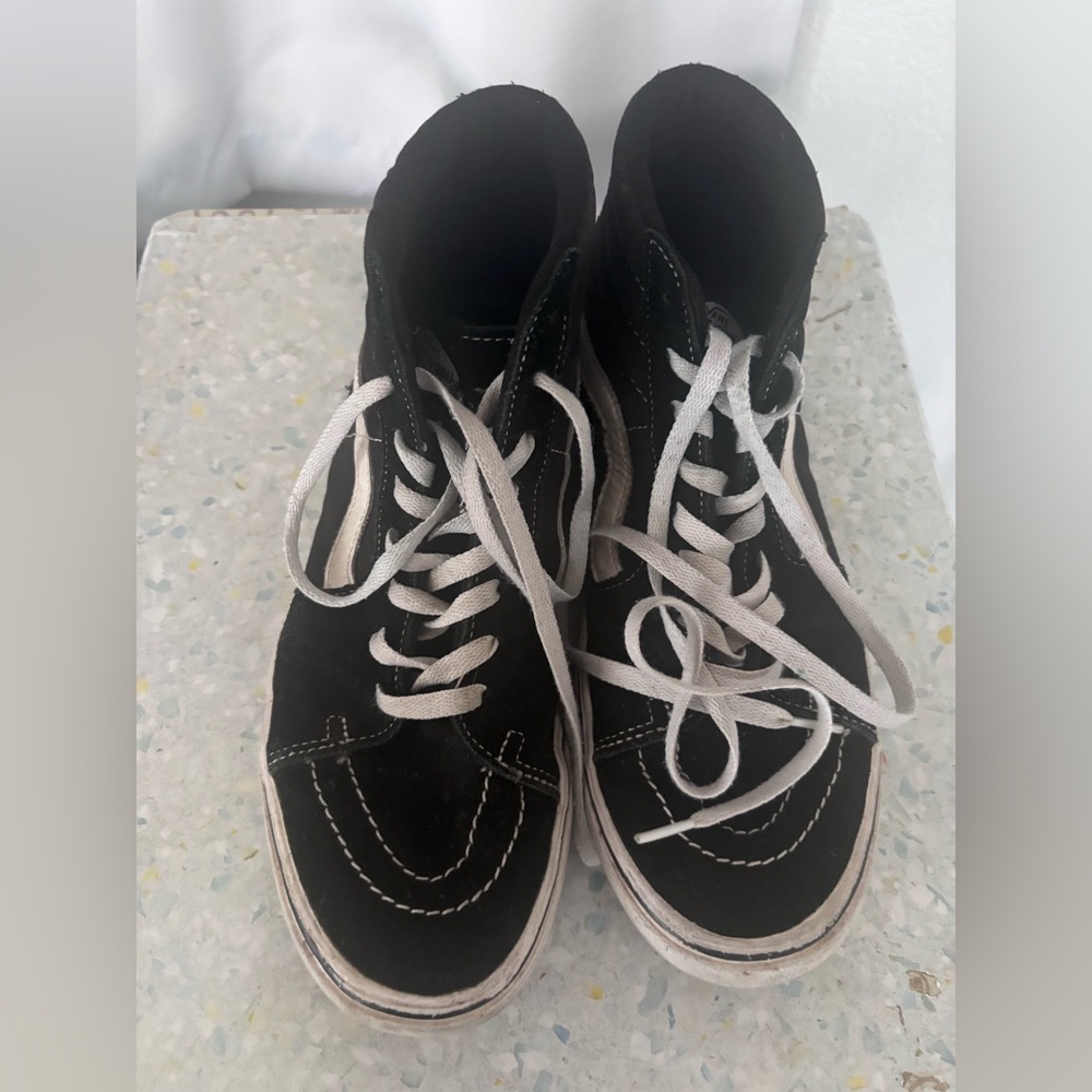 Black and white Vans Sk8-Hi high top.